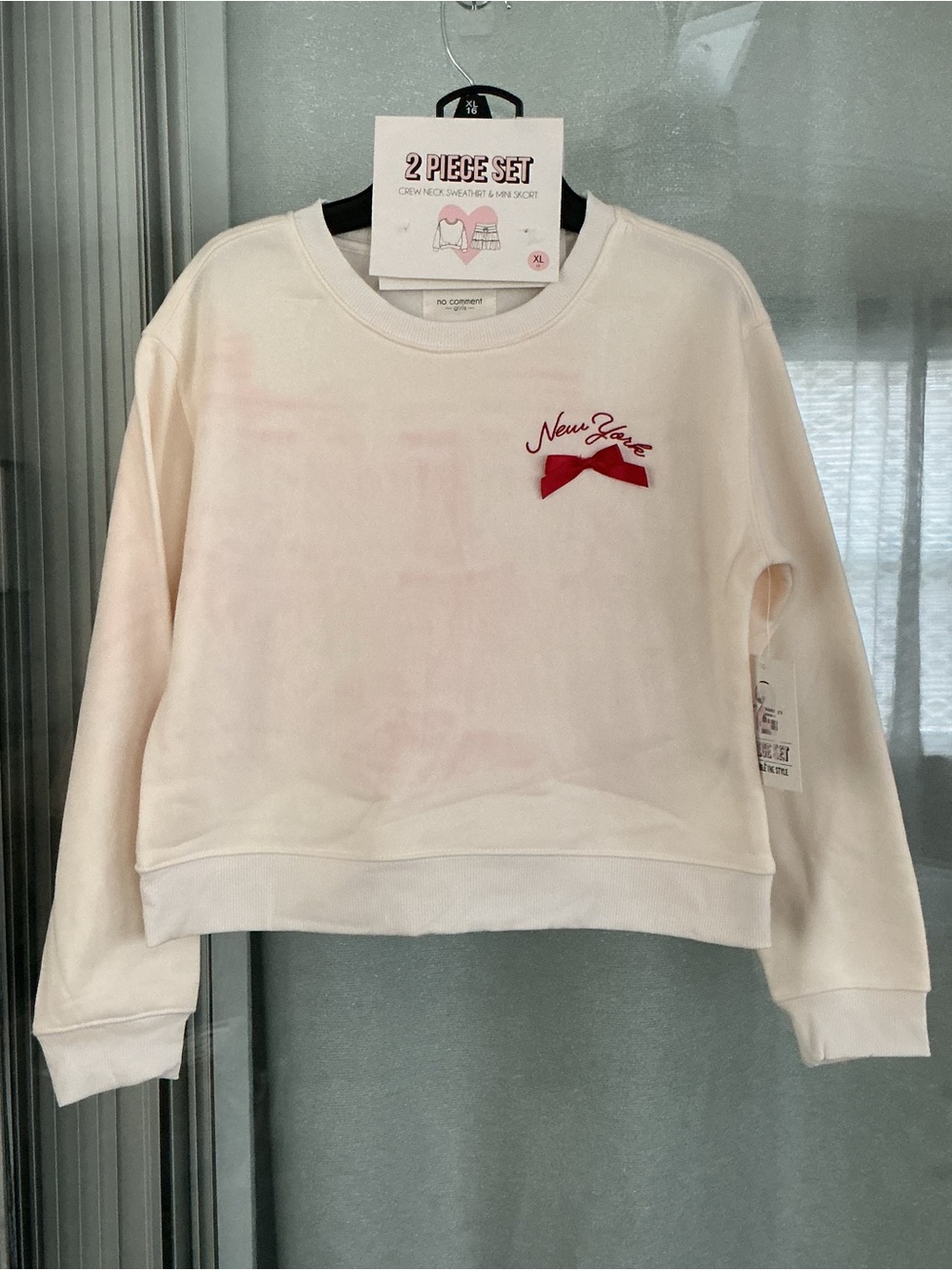 2 Piece Set that includes a crewneck sweatshirt and a matching mini skirt